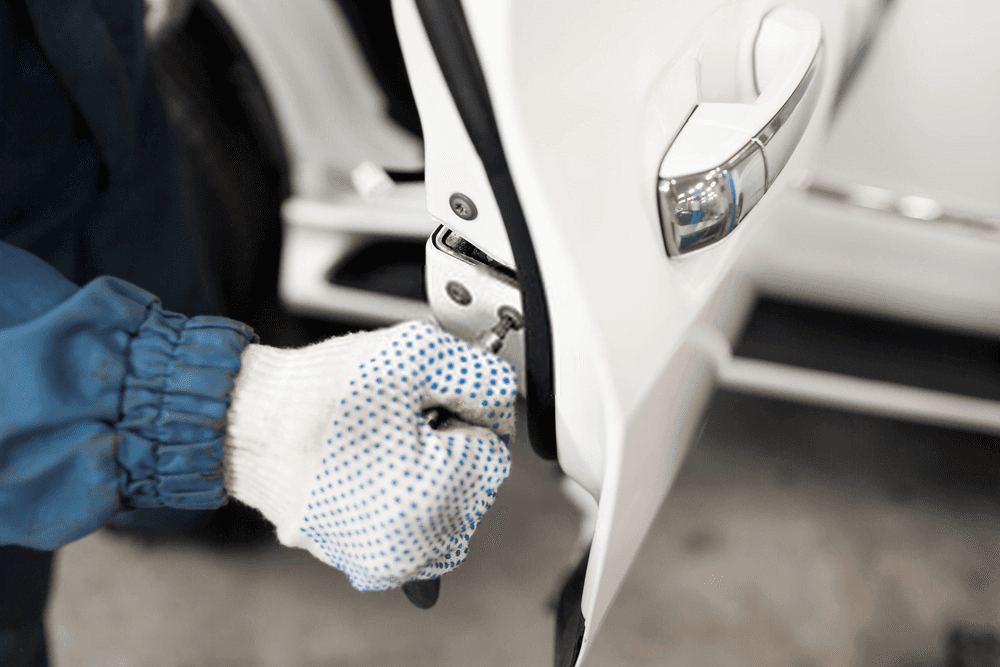 Automotive door lock repair close-up