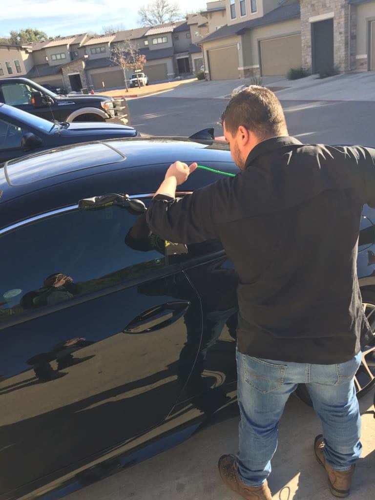 Locksmith opening a locked car door in San Antonio